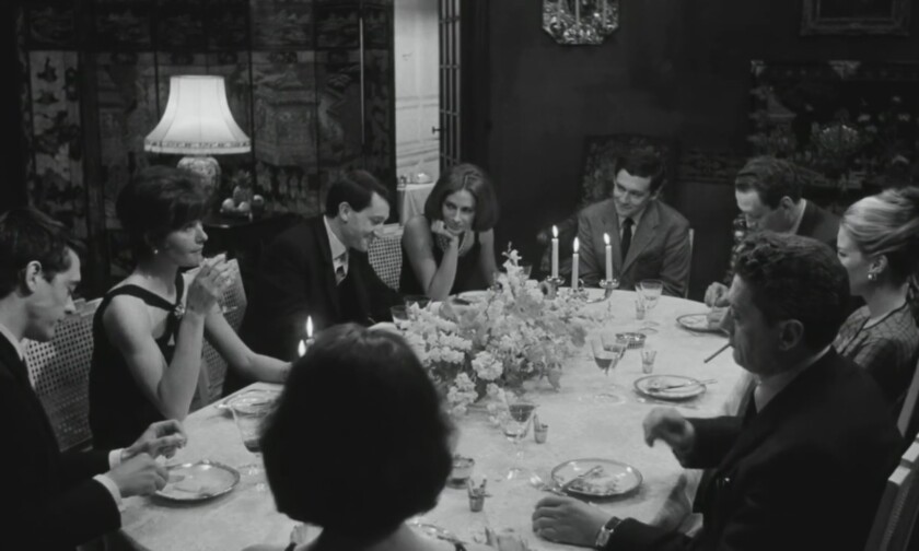 Film still of people at a dinner party