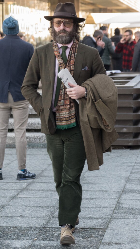 Photo from Pitti Uomo 89 - GG-700 brown fedora hat jacket green tie pants sunglasses scarf chukka boots
