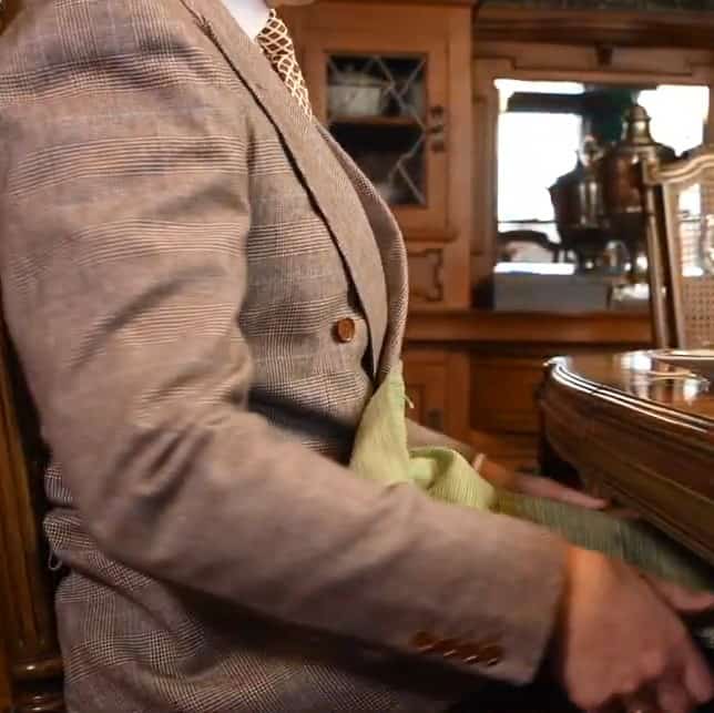 Photo of Raphael placing his napkin in his lap