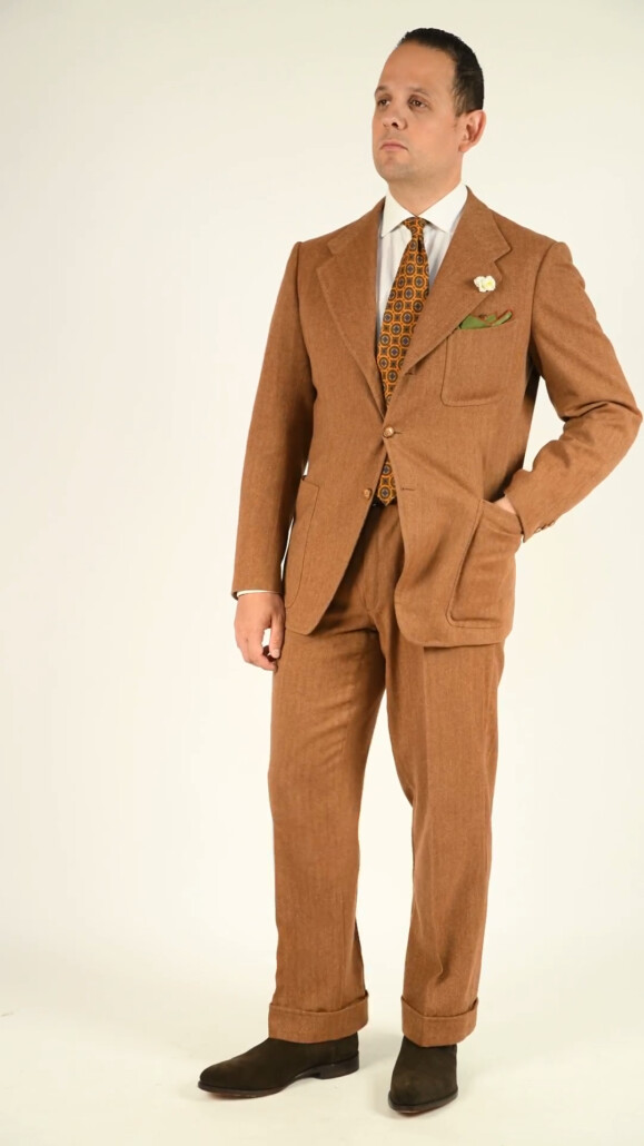 Photo of Raphael brown SB Herringbone suit suede chukka boots Olive Green Pocket Square Art Deco Egyptian Scarab pattern Wool Challis Tie Sunflower Yellow White Phlox Boutonniere Fort Belvedere[00-08]