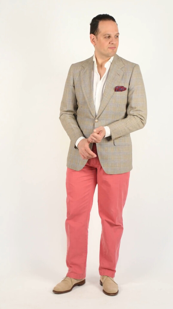 Photo of screen-glen check jacket with red orange overplaid, white shirt, Nantucket red pants, sand color chukka boots, burgundy with blue and yellow polka dot pocket square