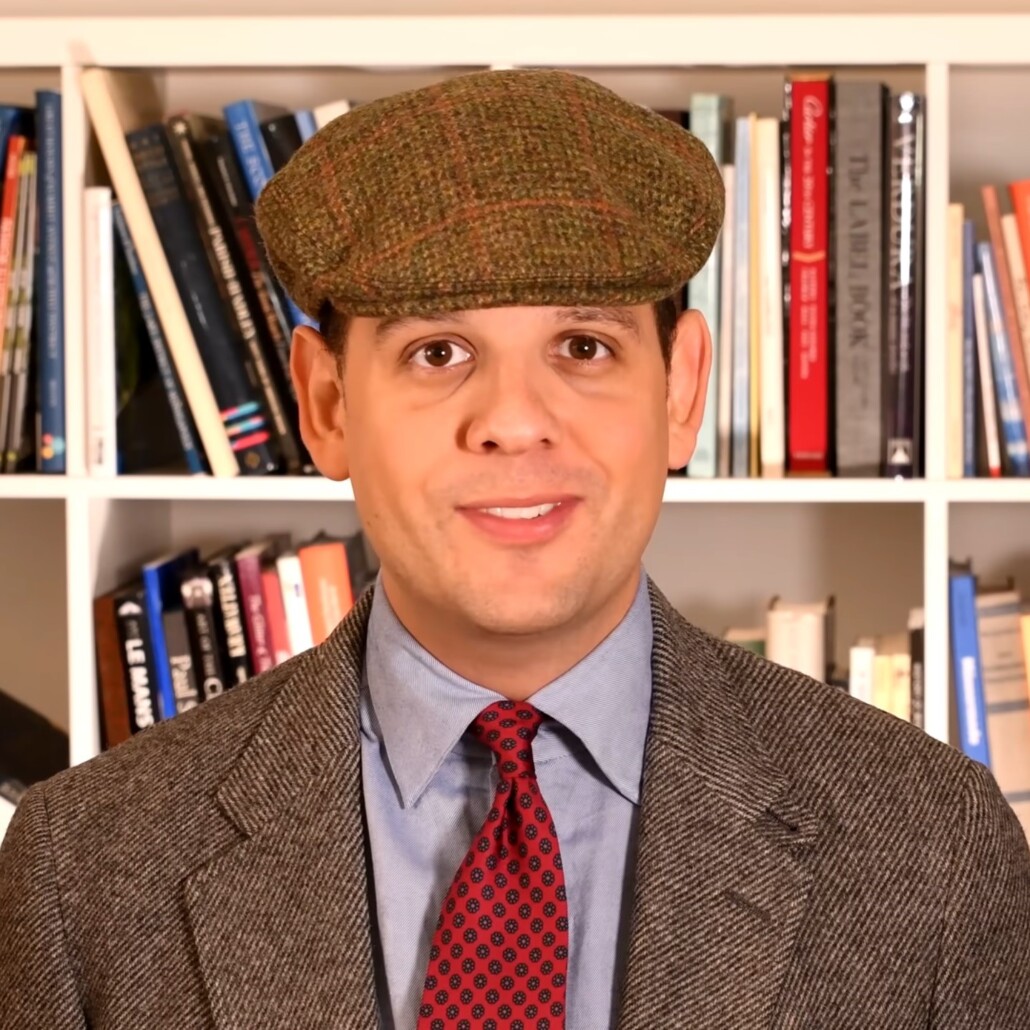 Photo of Olive green flat cap worn with gray diagonal weave jacket