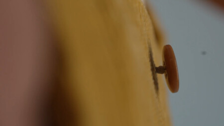 Photo of the shank on a corozo button on a pair of corduroy