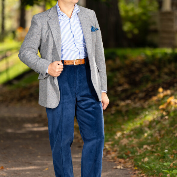 Photo of Raphael wearing Infantry Blue corduroy with gray sport coat and white and blue striped shirt