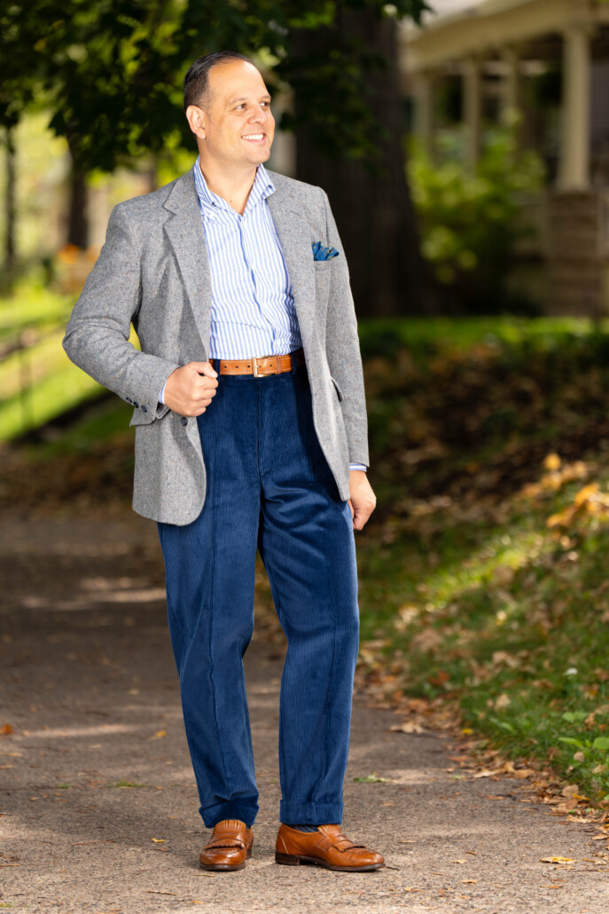 Photo of Raphael wearing Infantry Blue corduroy with gray sport coat and white and blue striped shirt