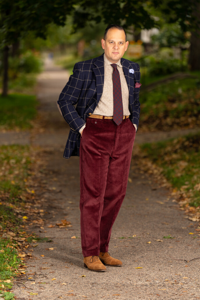 Photo of Raphael wearing Maroon corduroy with windowpane sport coat and red and blue tie