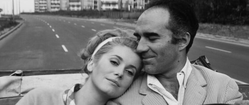 Photo of a man and woman in a car the man is wearing a corduroy jacket