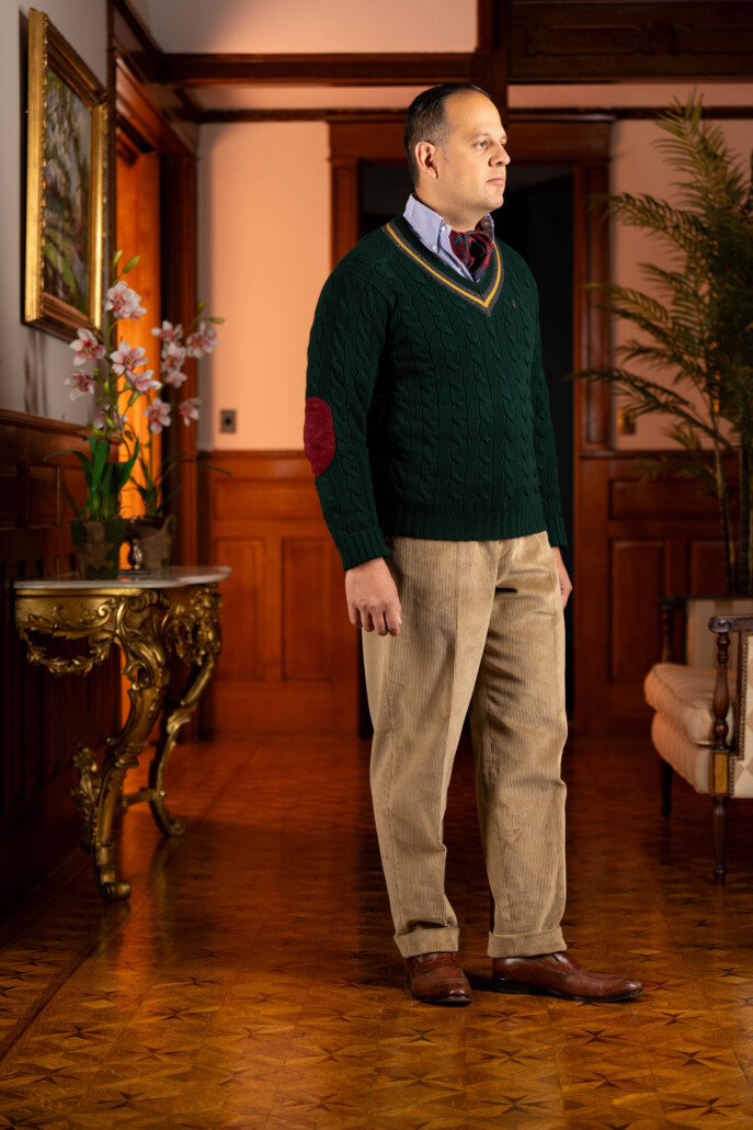 Photo of Raphael wearing Pale Taupe corduroy with green sweater and ascot