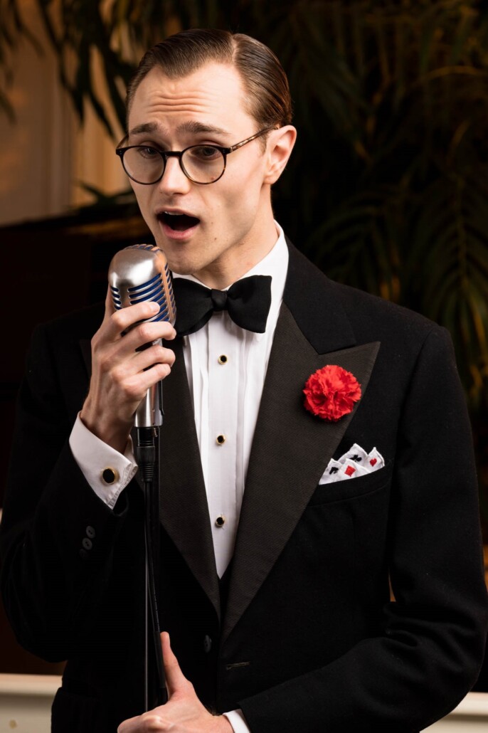Photo of Preston singing in Black Tie