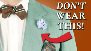 An ensemble consisting of a light green suit, white shirt, orange striped bow tie, and colorful boutonniere and pocket square; text reads, "Don't Wear This!" with an arrow pointing to the ensemble.