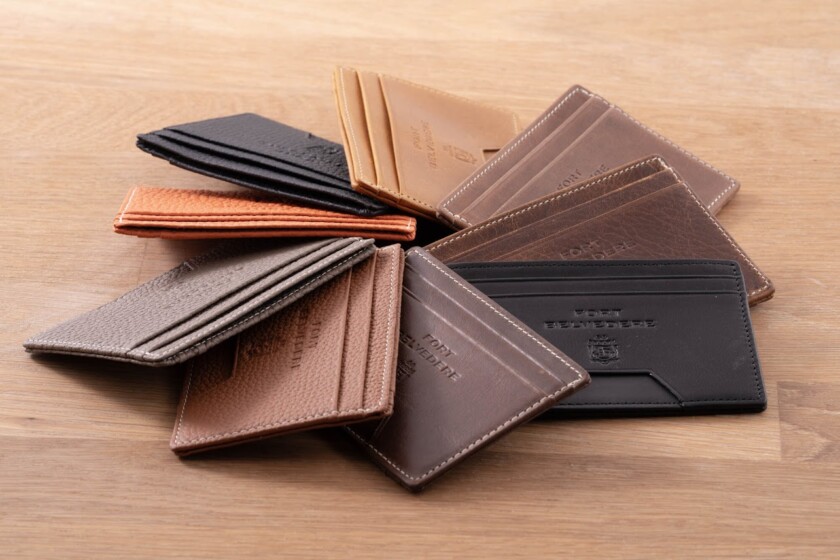 Photo of four slim wallets arranged in a pinwheel