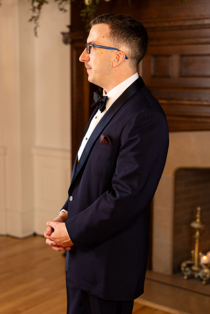 Photo of Burgundy pocket square worn with a midnight blue dinner suit