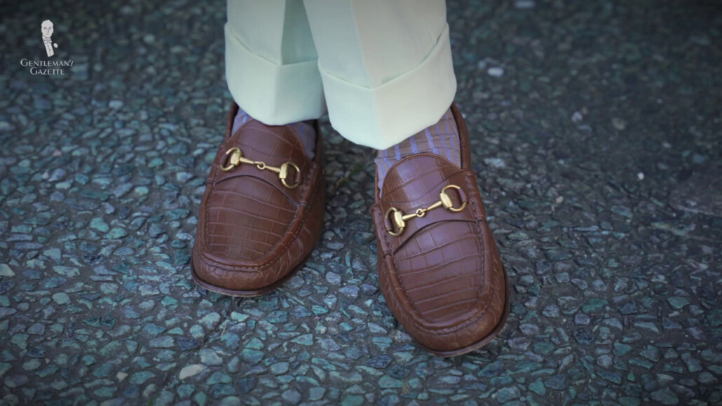 Gucci loafers in Crocodile and beige and light blue socks