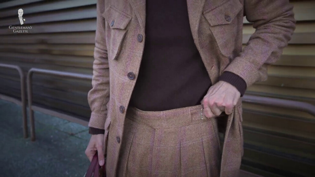 Jacket is of herringbone pattern and a cashmere sweater