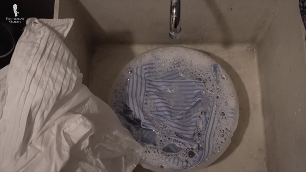 Soaking The Stained Fabric Into The Cold Water Soaking the stained fabric into the cold water.