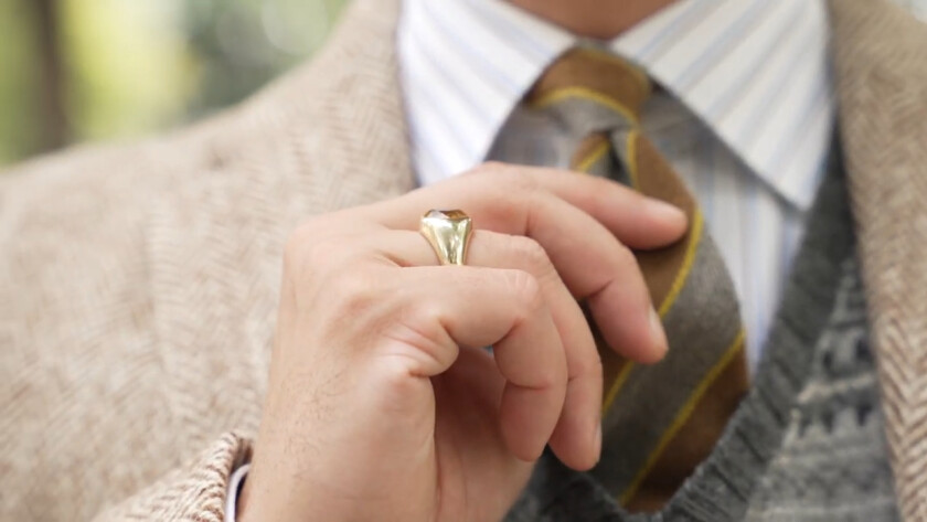 Photo of a ring worn with a suit