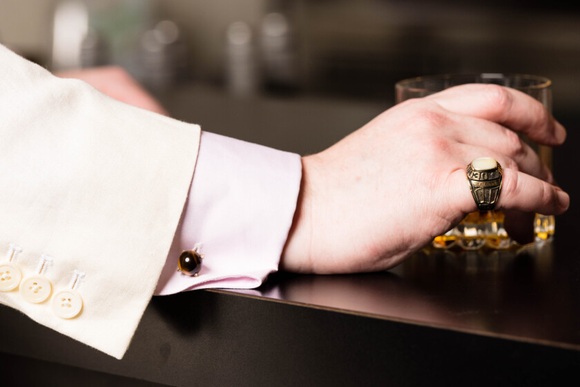 Photo of a ring worn with a cufflink