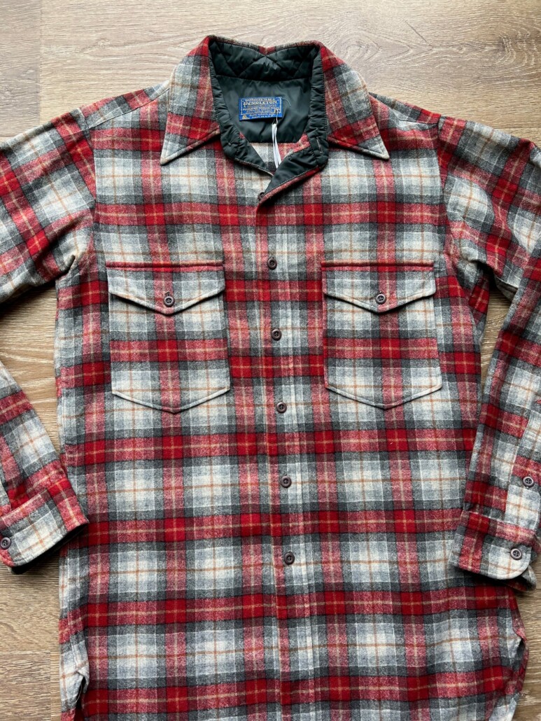 a vintage flannel shirt from the brand Pendleton in shades of red and grey
