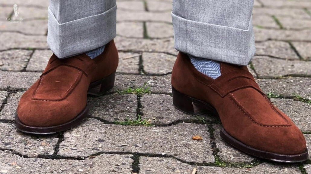 A brown well-fitting suede loafers