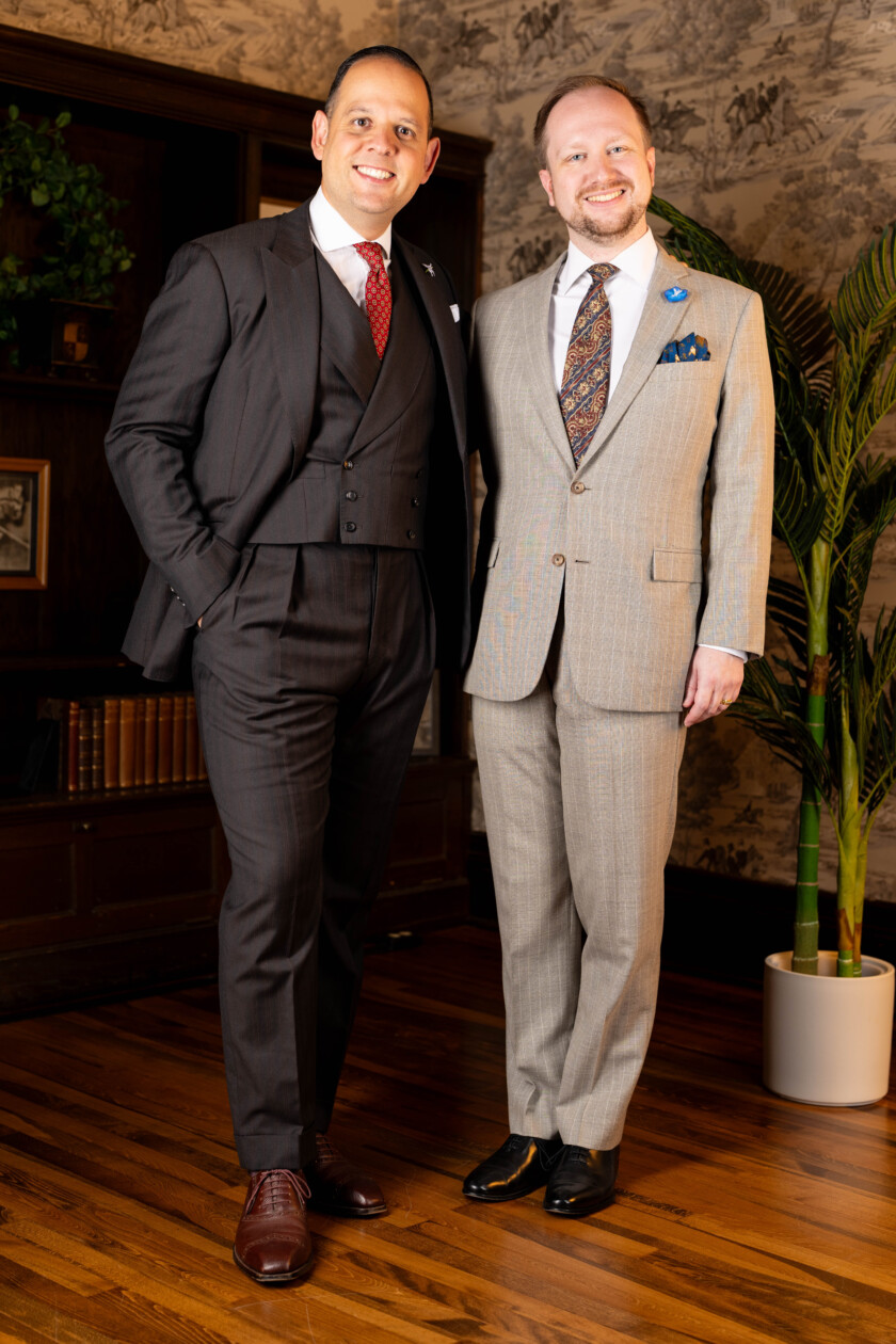 Photo of two men in cocktail attire