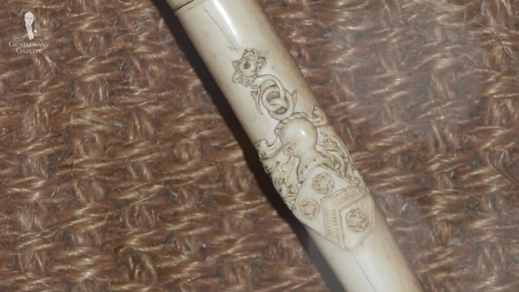 A cane designed with a coat of arms.