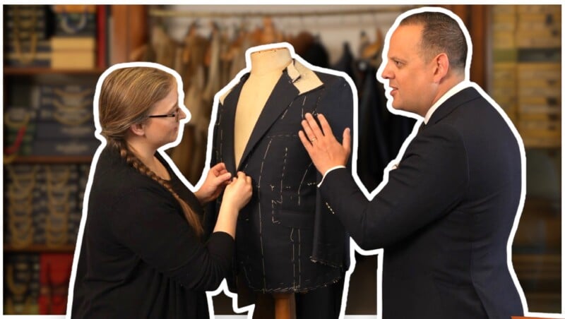 A man and woman chat in front of a mannequin.