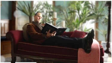 Raphael relaxes in a luxury house coat
