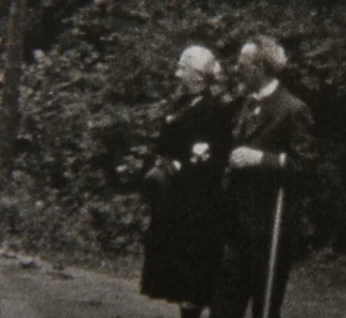 elderly couple walking together