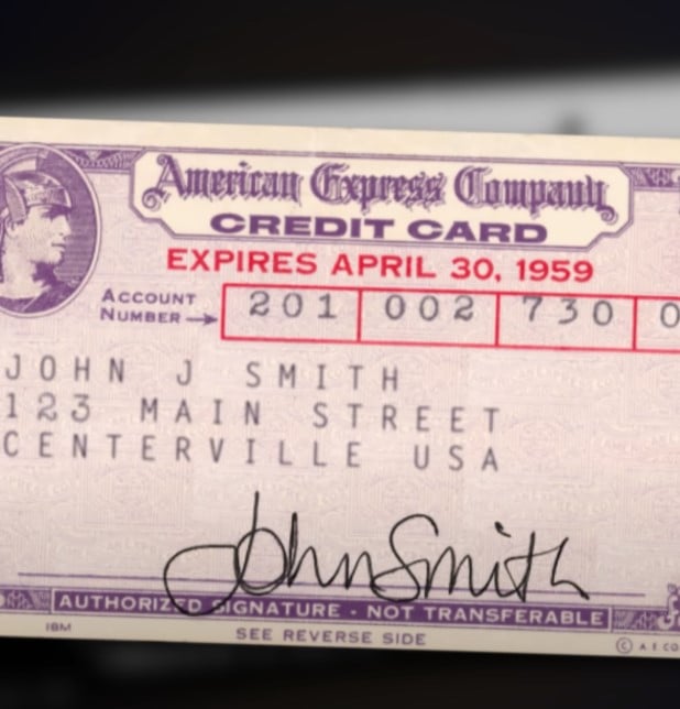 Close-up of a vintage purple American Express credit card from 1959.