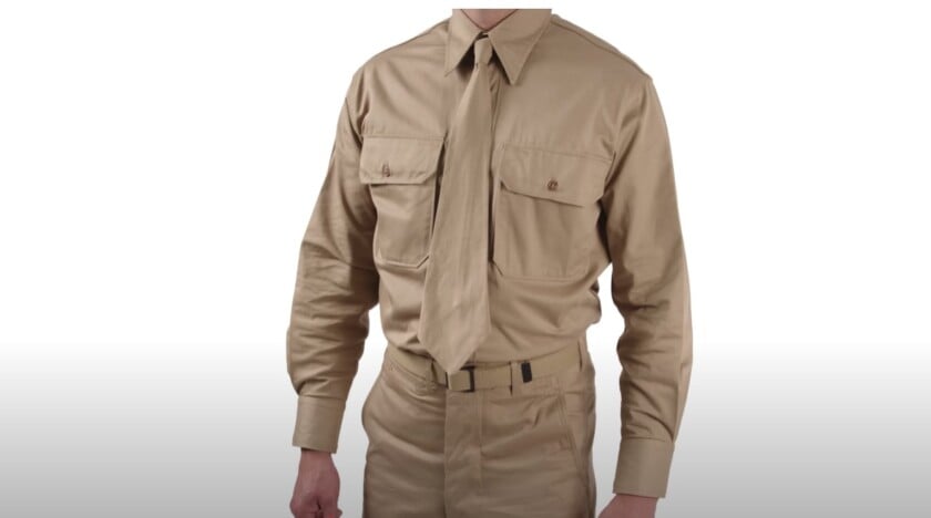 wwii american military uniform belt Torso view of a man wearing a WWII-era American GI uniform.