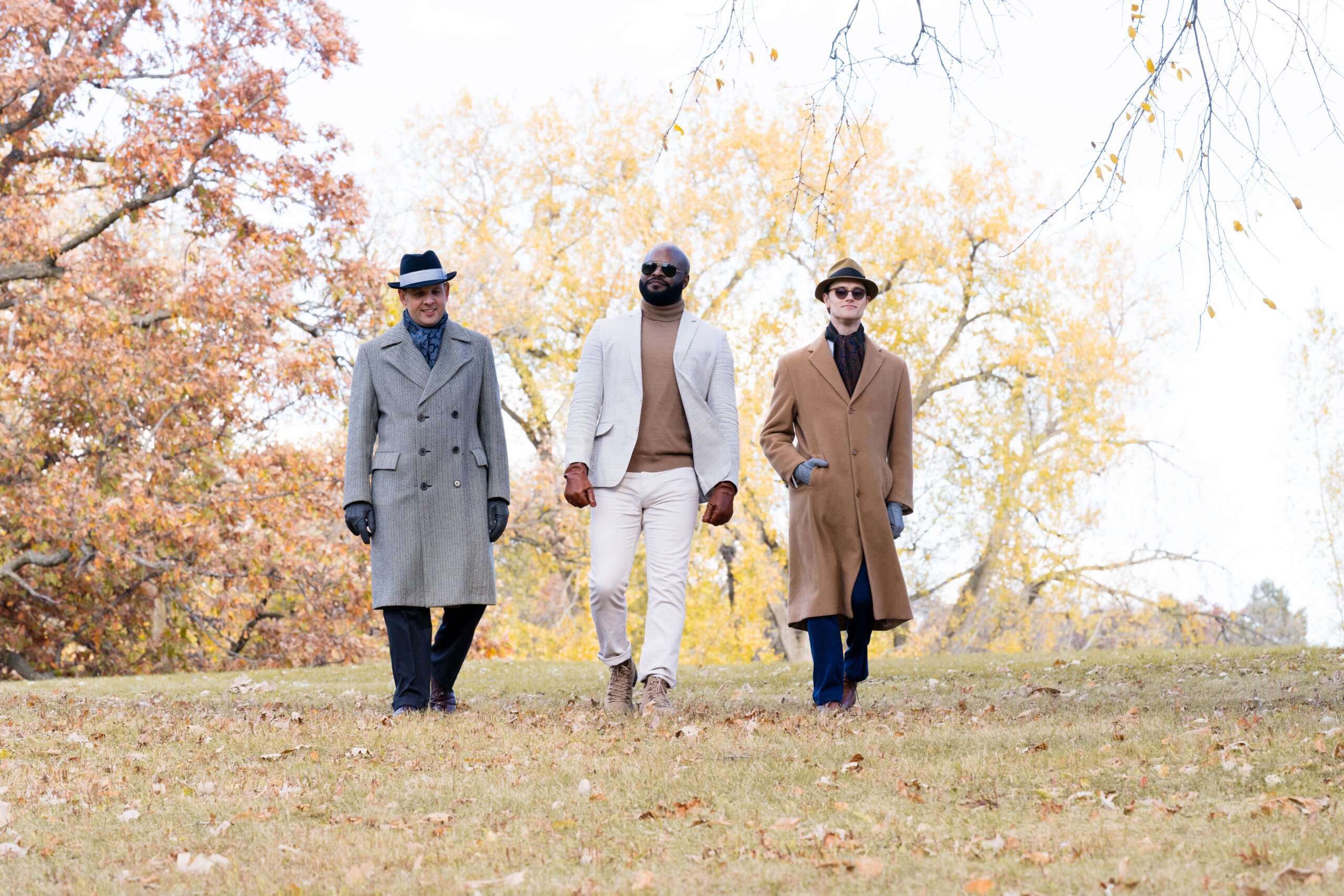 Raphael, Kyle, and Preston walking in a fall scene