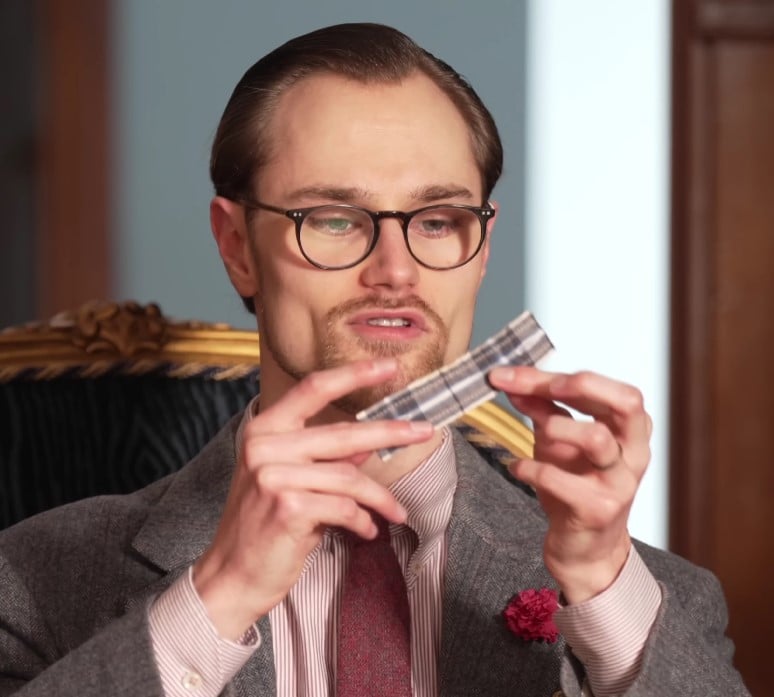 preston diy tie strap Preston from Gentleman's Gazette holding up a DIY tie strap made from a small piece of patterned fabric.