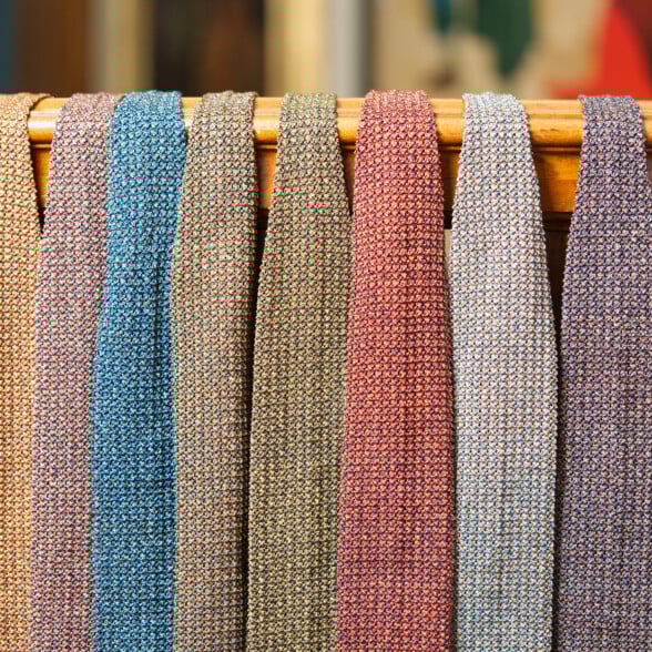 Ascot Melange Silk Knit Ties Group Shot 1 6000 By 4000 Melange silk knit ties on a rack