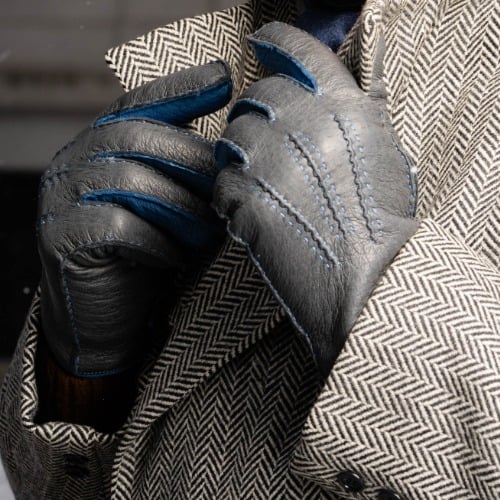 Gray and blue leather gloves