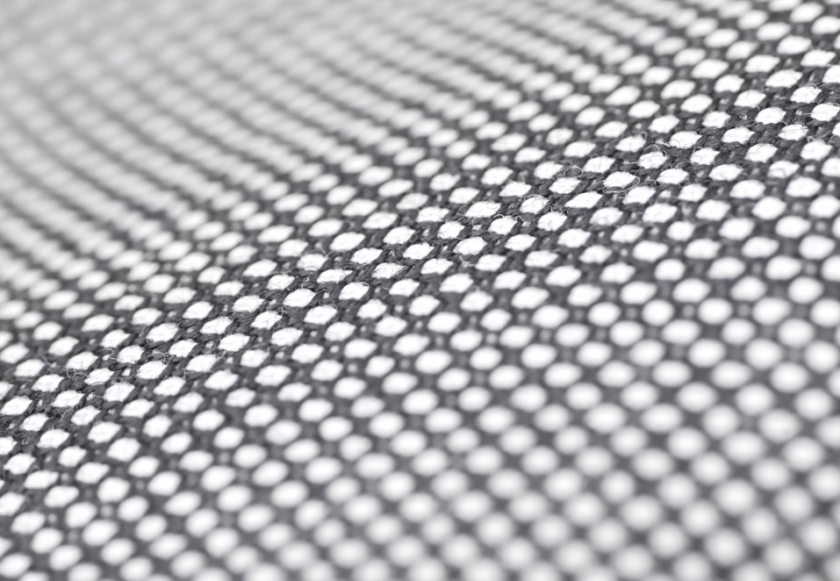 Birds Eye Weave Worsted Wool Close Up Extreme close-up of gray bird's eye worsted wool showing the small repeating diamond pattern formed by light and dark yarns