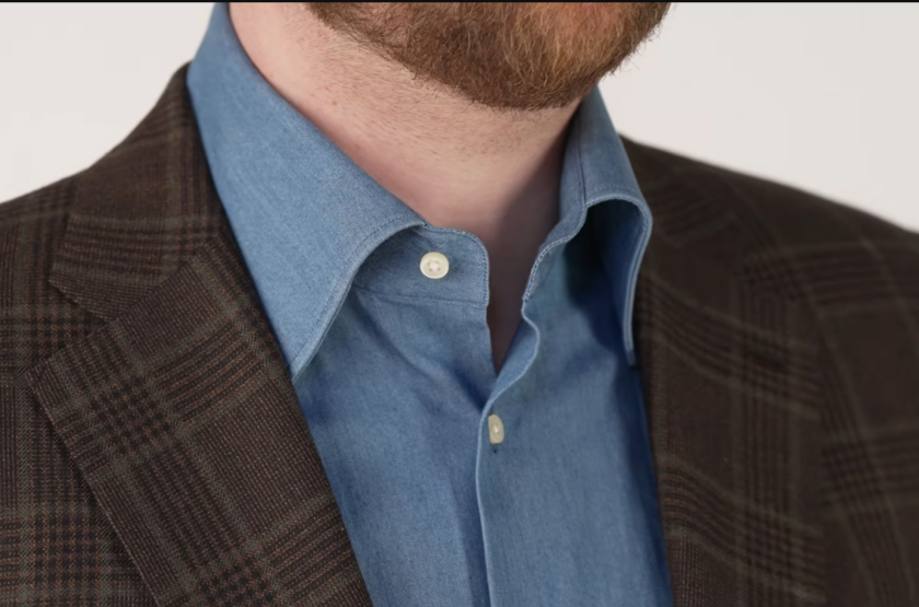 Chambray Blue Shirt Open Collar Blue chambray shirt worn open at the collar under a brown Glen check jacket