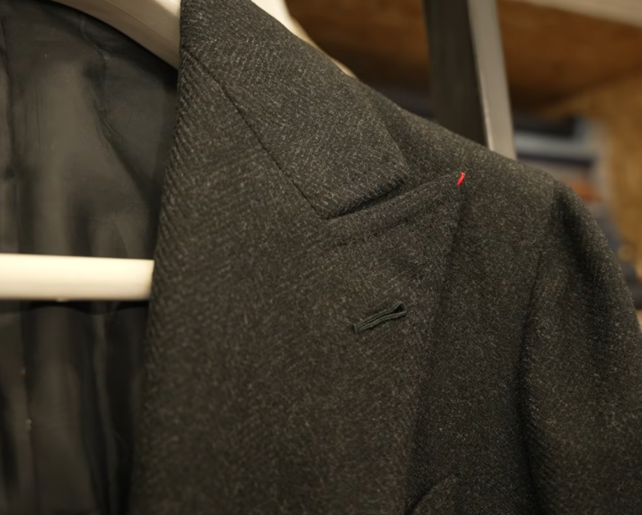 Worsted Flannel Charcoal Jacket Lapel Charcoal worsted flannel jacket lapel on a hanger